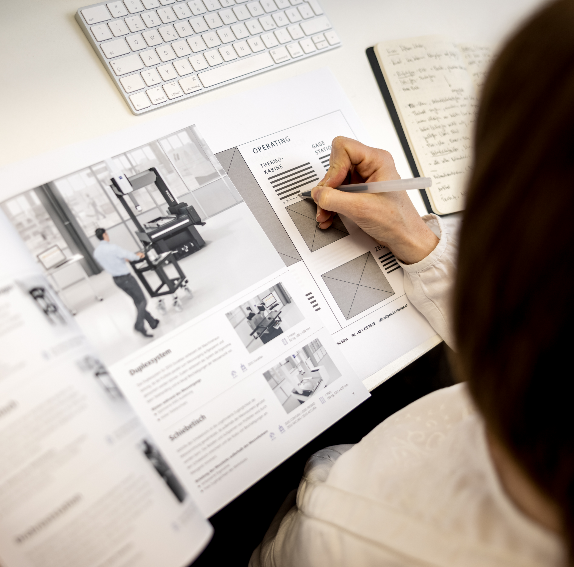 Simone taking notes on print brochure wireframes | marketing strategy content creation Vienna