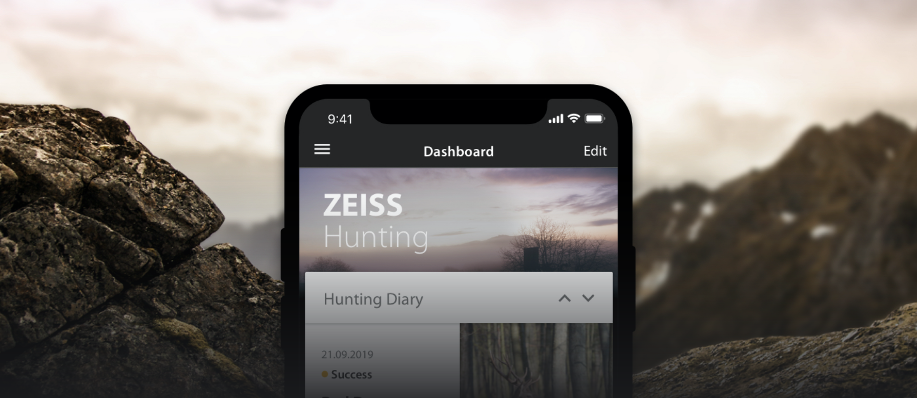 Phone with ZEISS Hunting app and mountainous backdrop