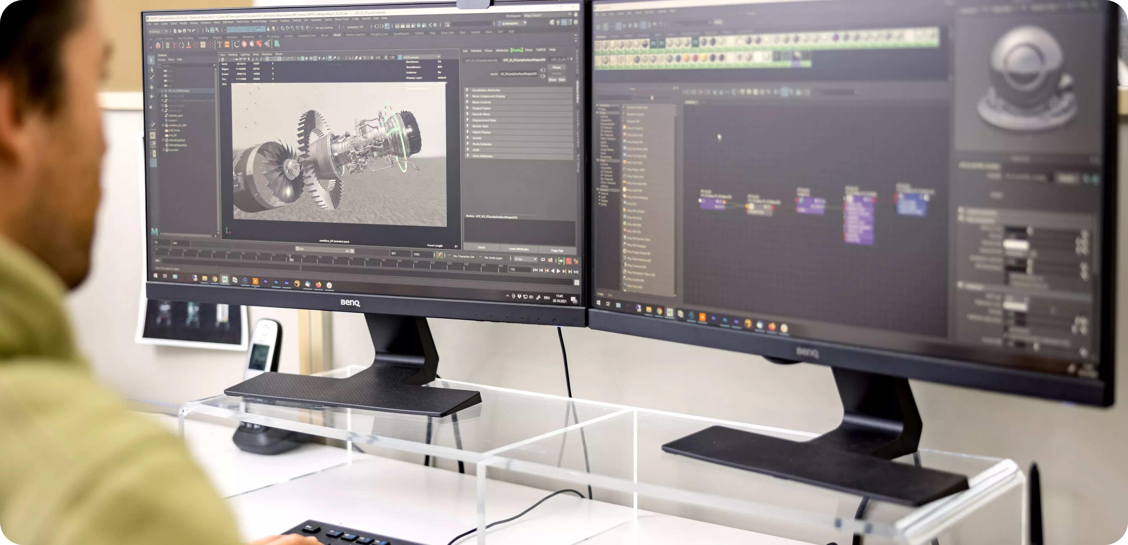 Dominik looking at his desktop monitors, showing animation work in progress | 3d animation motion design Wien